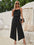 Jumpsuit mit asymmetrischem Ausschnitt und Kettendetail