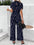 Jumpsuit mit weitem Bein und Stehkragen, Druck und Bindeband